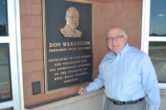 Chancellor Gornick helped to dedicate the new Student Center to former President Donald Warkentin.